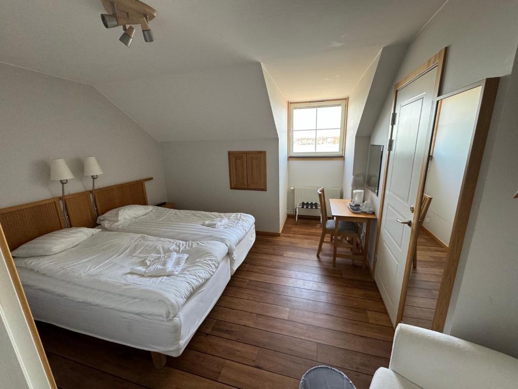 Postel nebo postele na pokoji v ubytování Gryts Sea Lodge