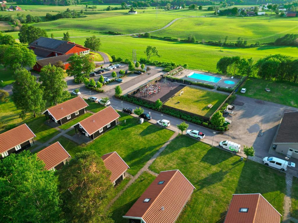 an aerial view of a parking lot with a pool at Dal Gjestegaard in Skoppum
