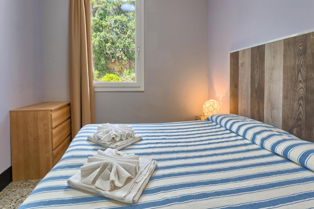 Posteľ alebo postele v izbe v ubytovaní Blue Beach