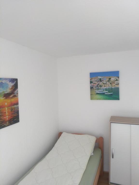 Ένα ή περισσότερα κρεβάτια σε δωμάτιο στο Hostel Trajan