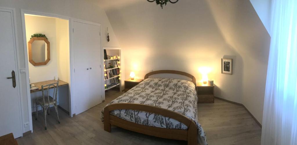 Postel nebo postele na pokoji v ubytování Le Pas du Faon