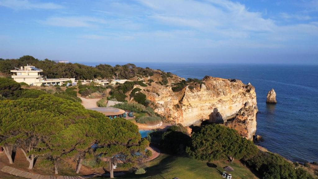 an aerial view of a cliff in the ocean at Foz Club - Algarve in Alvor
