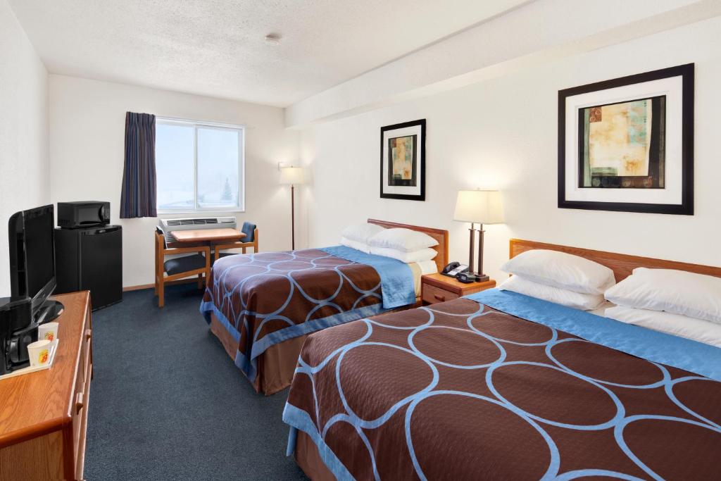 Postel nebo postele na pokoji v ubytování Super 8 by Wyndham Swift Current