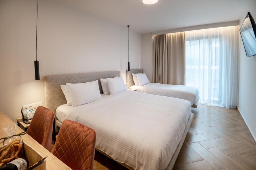Postel nebo postele na pokoji v ubytování IRA - ΗΡΑ Hotel