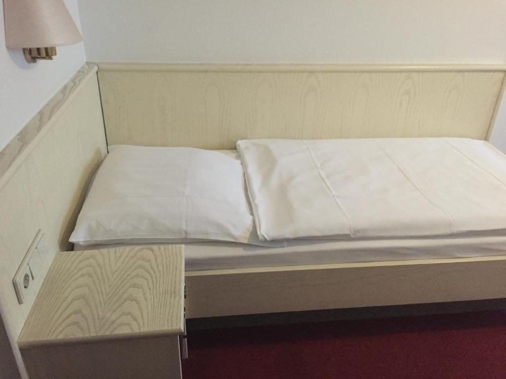 Postel nebo postele na pokoji v ubytování Hotel Görres