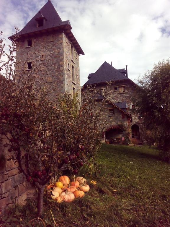 a pile of fruit sitting in front of a building at Casa Rural Fontamil in Gistaín
