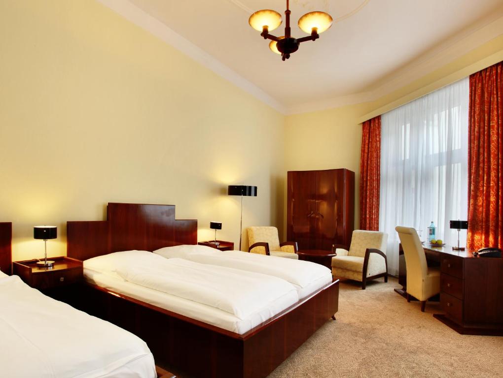 Postel nebo postele na pokoji v ubytování Hotel Bellmoor im Dammtorpalais