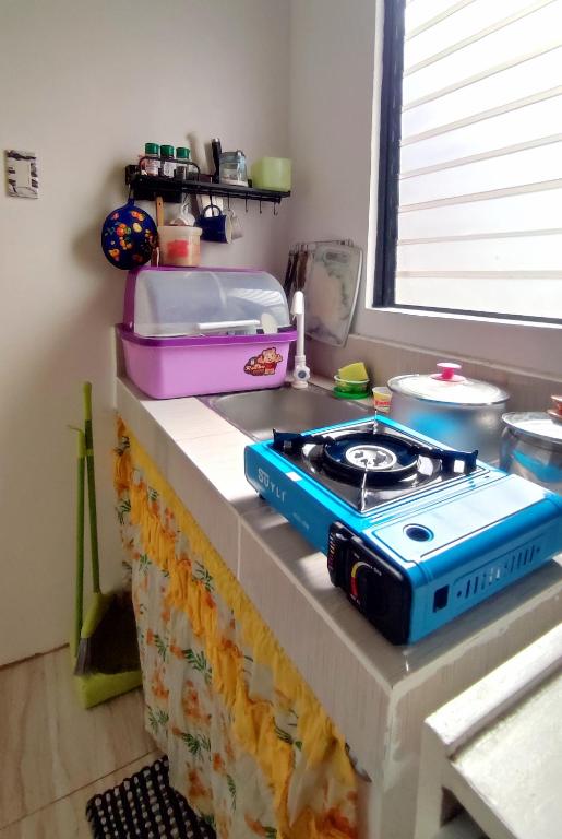 a stove top oven sitting on top of a counter at Olango Transient Home,with WIFI &Netfix in Santa Rosa