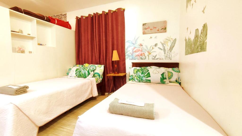a room with two beds and a window at Olango Transient Home,with WIFI &Netfix in Santa Rosa