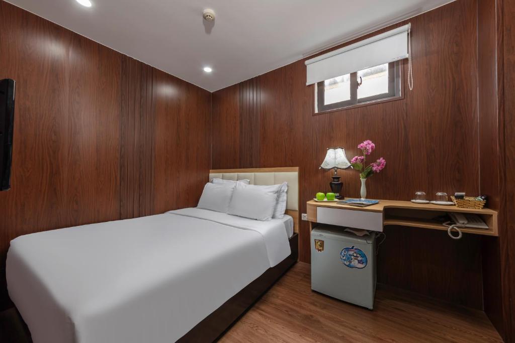 Postel nebo postele na pokoji v ubytování Millennium Hanoi Hotel