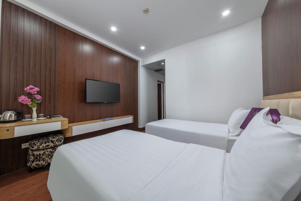 Postel nebo postele na pokoji v ubytování Millennium Hanoi Hotel