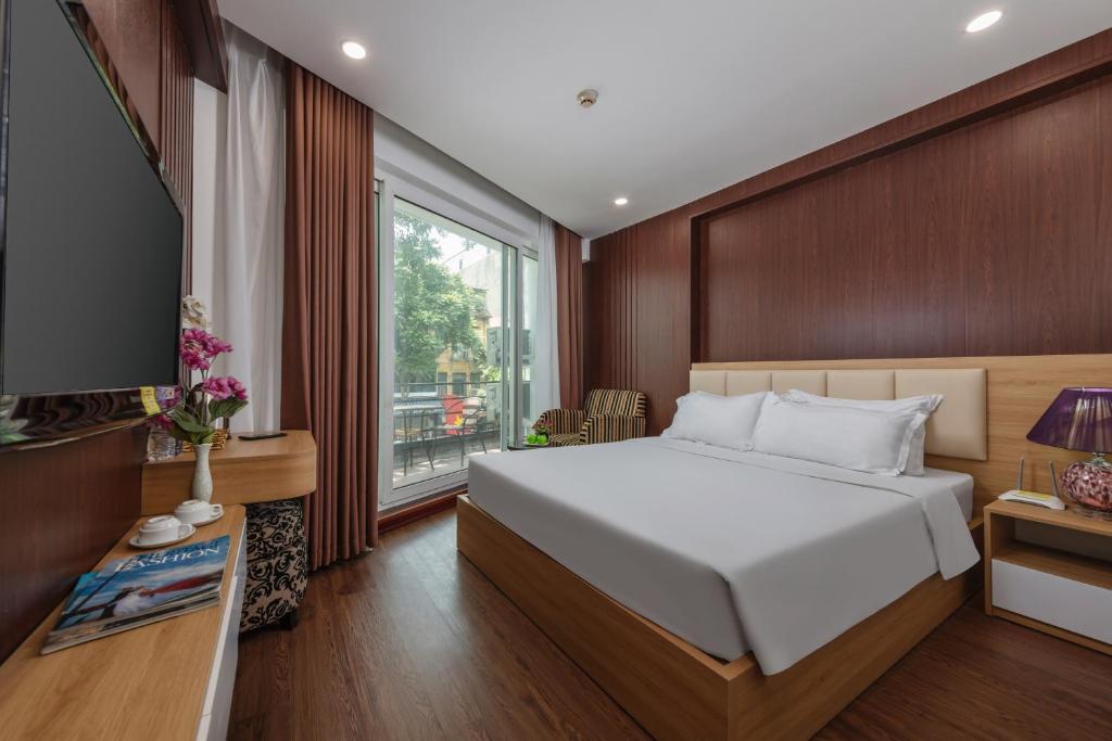 Postel nebo postele na pokoji v ubytování Millennium Hanoi Hotel