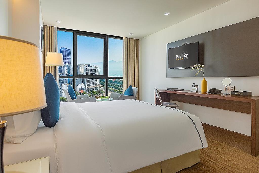 Postel nebo postele na pokoji v ubytování Pavilion Hotel Da Nang