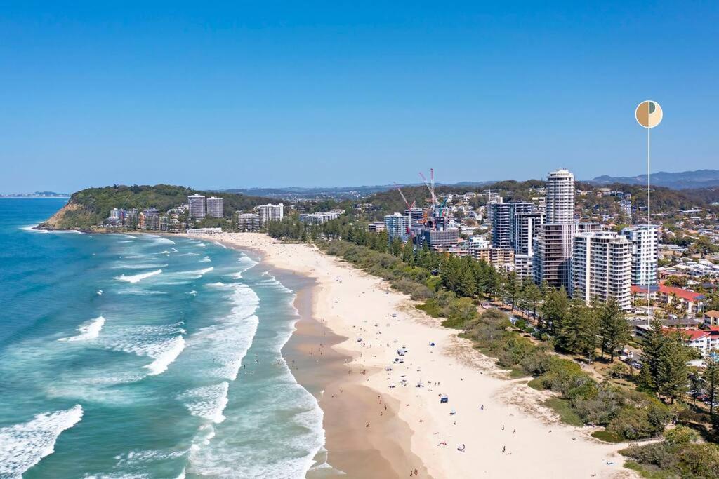 an aerial view of a beach and the ocean at Beachfront Retreat at Burleigh, Breezy and Cosy in Gold Coast