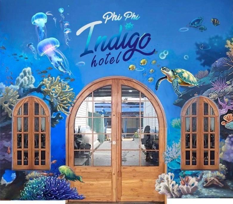 a wall mural of an aquarium in a restaurant at Phi Phi Indigo Hotel in Phi Phi Don