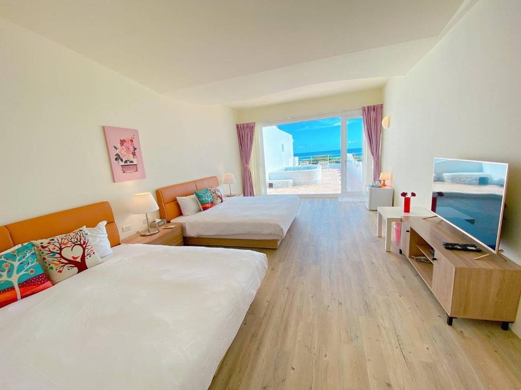 Postel nebo postele na pokoji v ubytování Vanilla Sea View Homestay