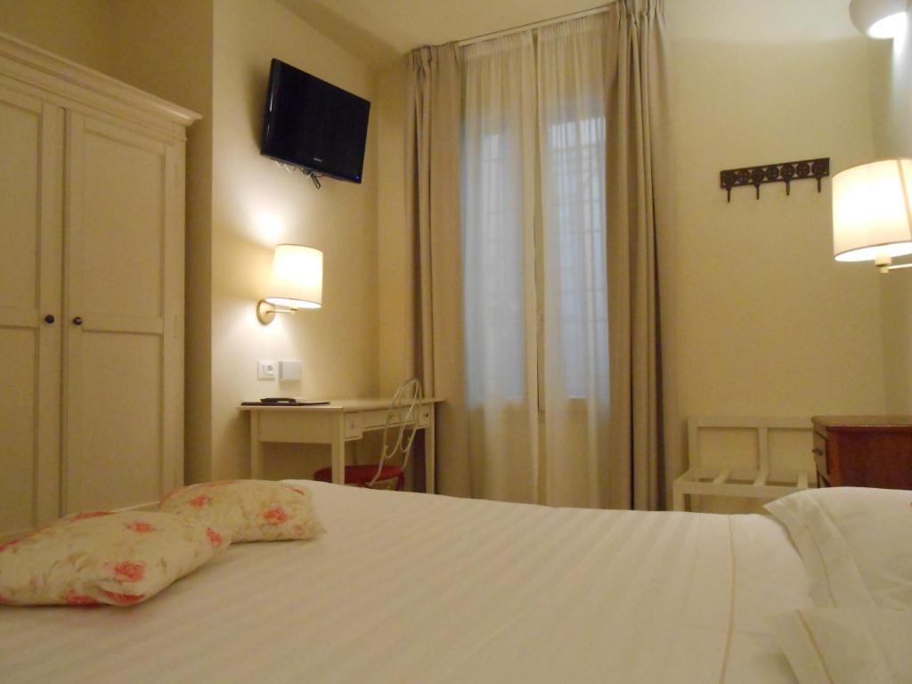 Łóżko lub łóżka w pokoju w obiekcie Hotel Atlantic