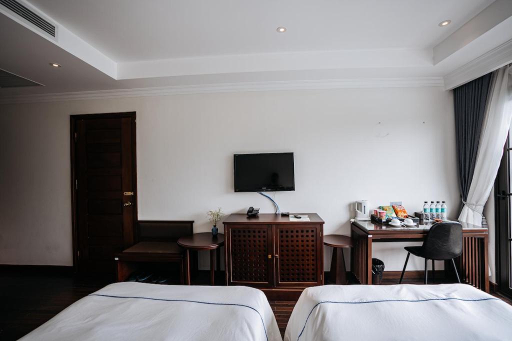 Postel nebo postele na pokoji v ubytování Paradise Soc Son Resort