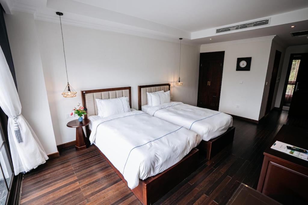Postel nebo postele na pokoji v ubytování Paradise Soc Son Resort