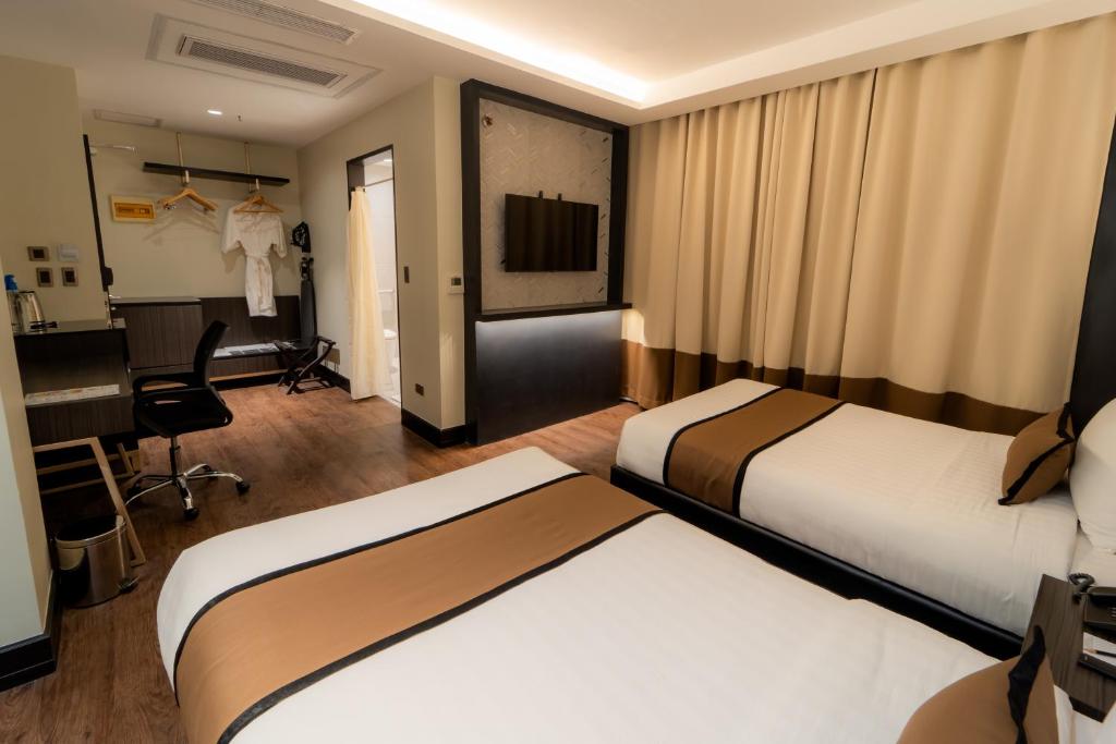 Postel nebo postele na pokoji v ubytování MetroCentre Hotel