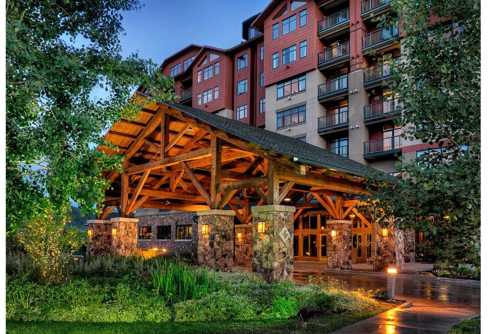 a wooden bridge in front of a building at The Steamboat Grand in Steamboat Springs