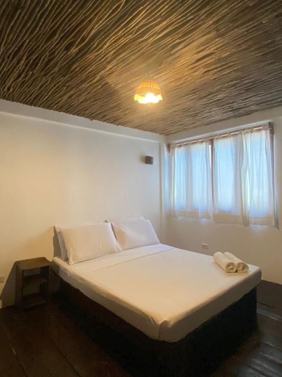 Postel nebo postele na pokoji v ubytování Boracay Coco Huts