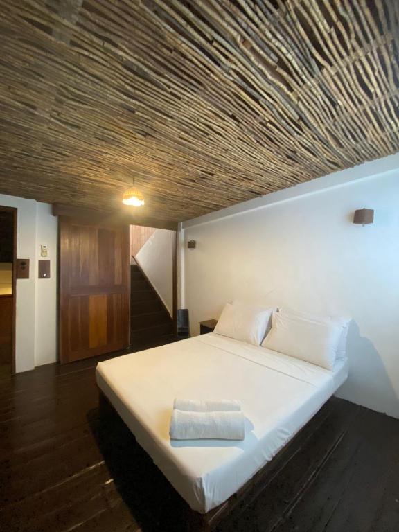 Postel nebo postele na pokoji v ubytování Boracay Coco Huts