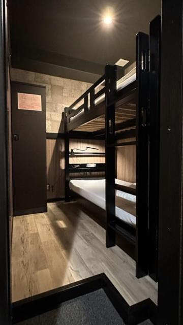 Postel nebo postele na pokoji v ubytování Hotel Capsule Inn Shizuoka