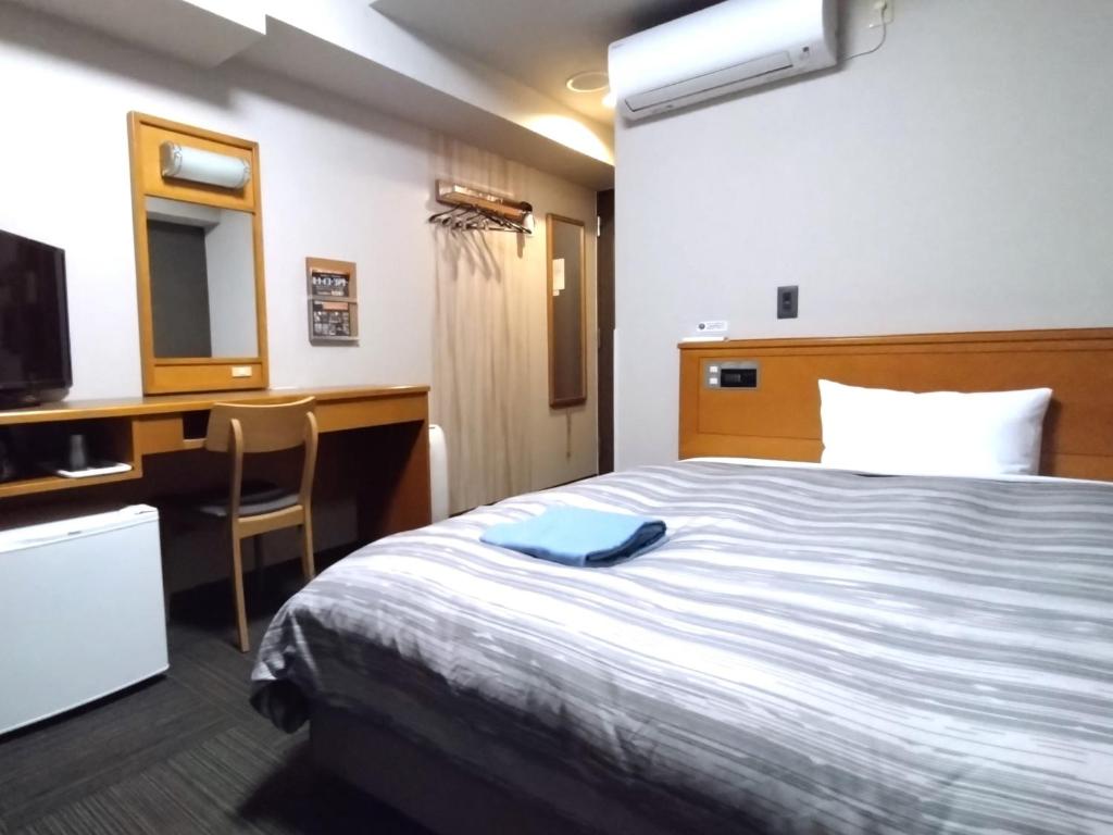 Postel nebo postele na pokoji v ubytování Hotel Route-Inn Hitachitaga