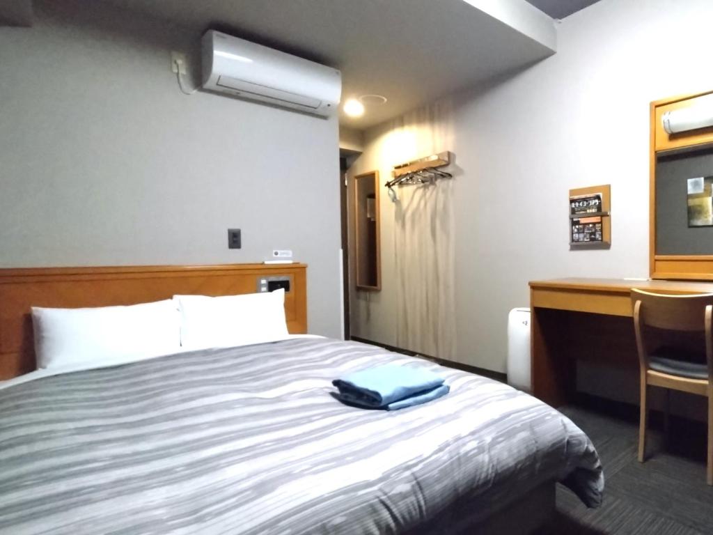 Postel nebo postele na pokoji v ubytování Hotel Route-Inn Hitachitaga
