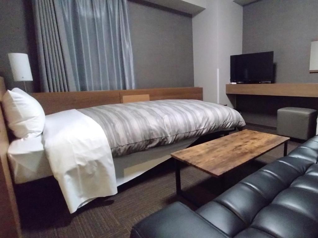 TV a/nebo společenská místnost v ubytování Hotel Route-Inn Hitachitaga