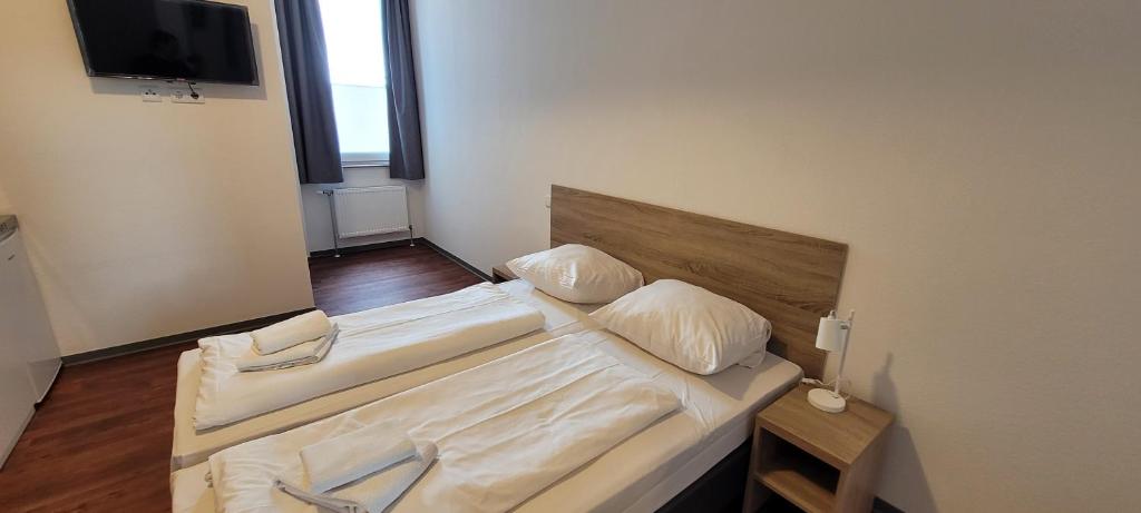 Postel nebo postele na pokoji v ubytování Queens Residenz
