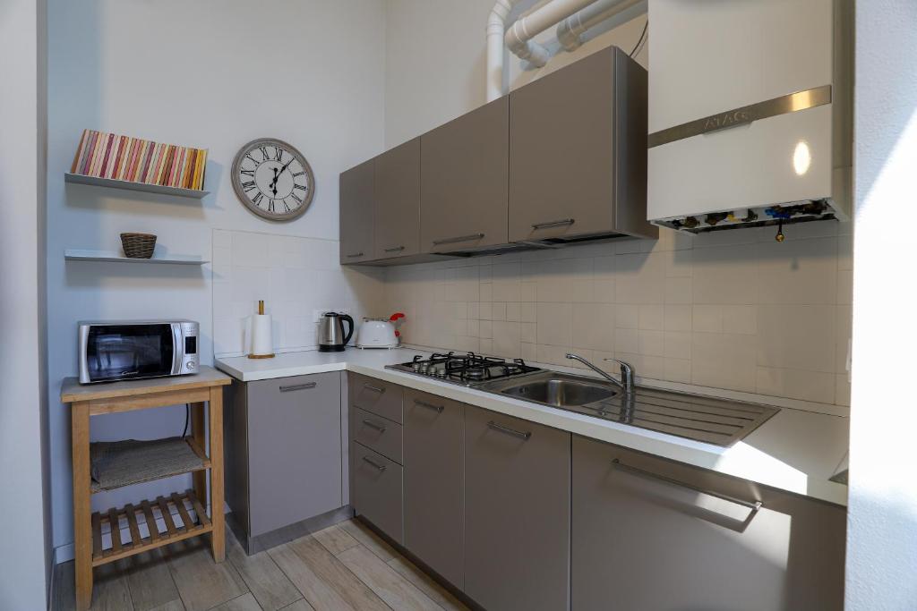 Kuchyň nebo kuchyňský kout v ubytování Le Querce Apartments