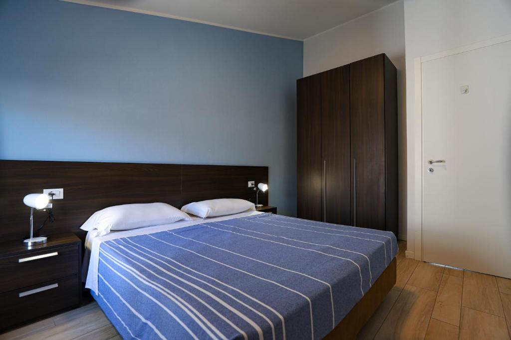 Postel nebo postele na pokoji v ubytování Le Querce Apartments