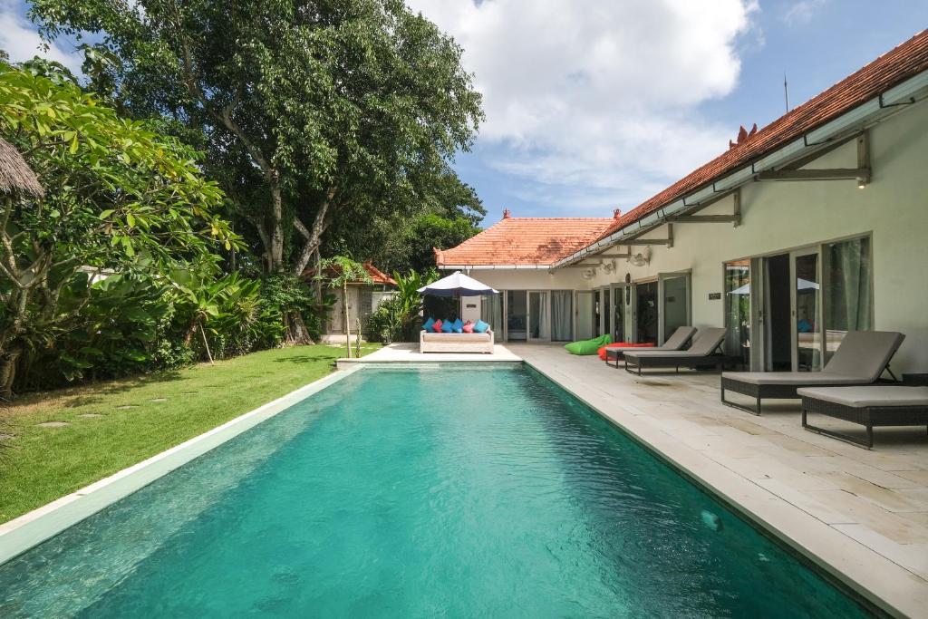 a swimming pool in the backyard of a house at Villa Alexandra Bingin in Uluwatu