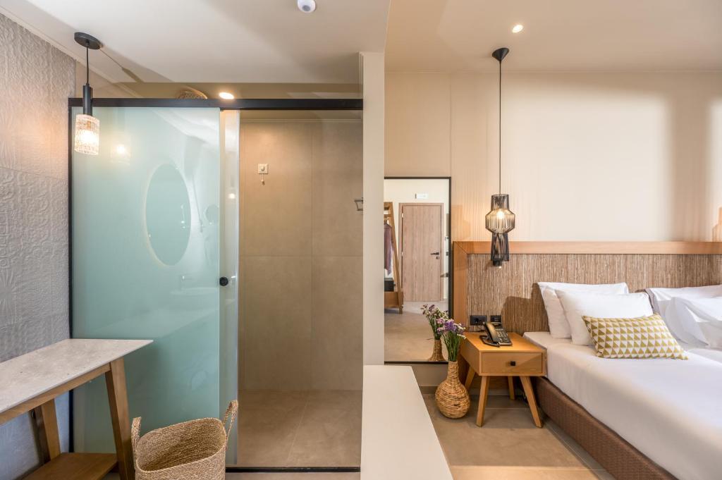 Postel nebo postele na pokoji v ubytování Hotel Pyriá