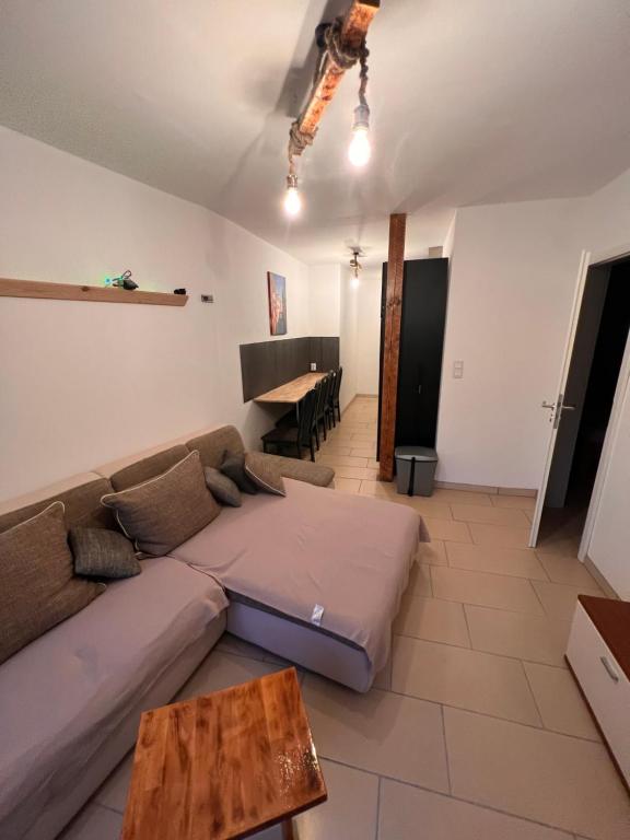a living room with a couch and a table at Zum Wall in Saal