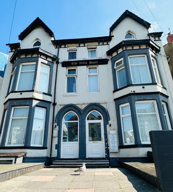 a building with a bird standing in front of it at The Villa Hotel in Blackpool