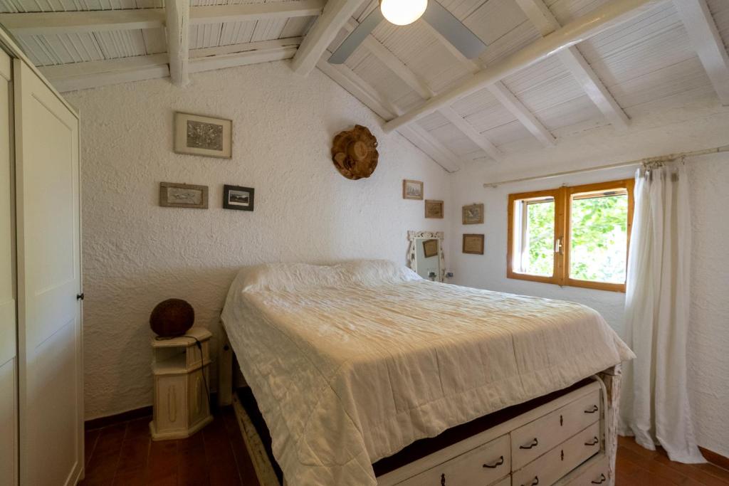 Posteľ alebo postele v izbe v ubytovaní Cottage Pura Vigna immerso nella natura vicino al mare