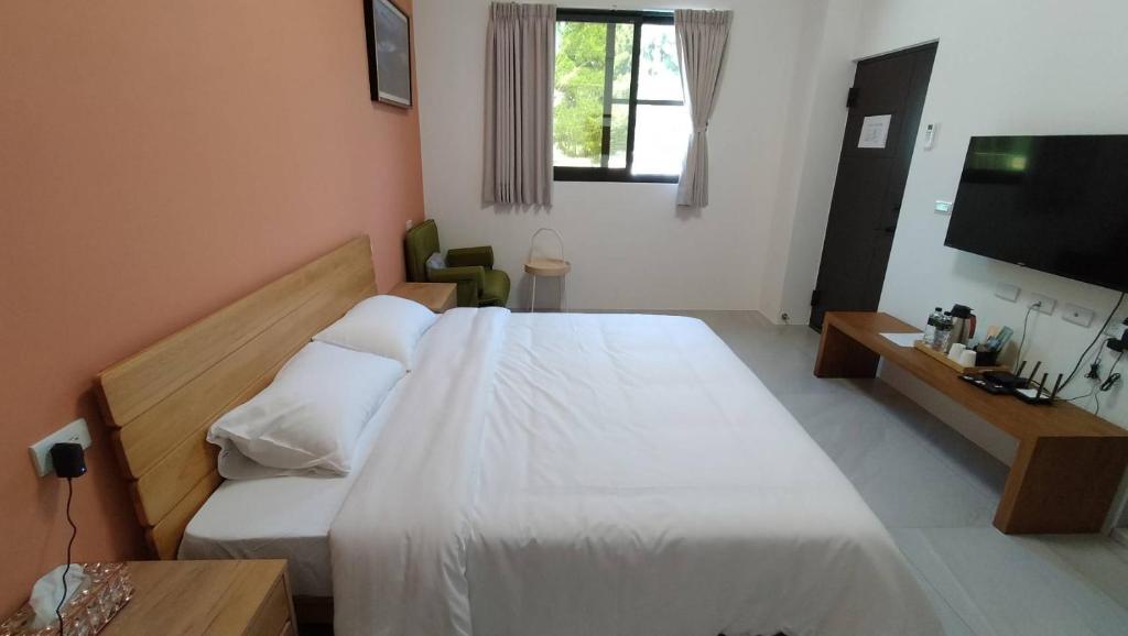 Postel nebo postele na pokoji v ubytování Liangchen B&B