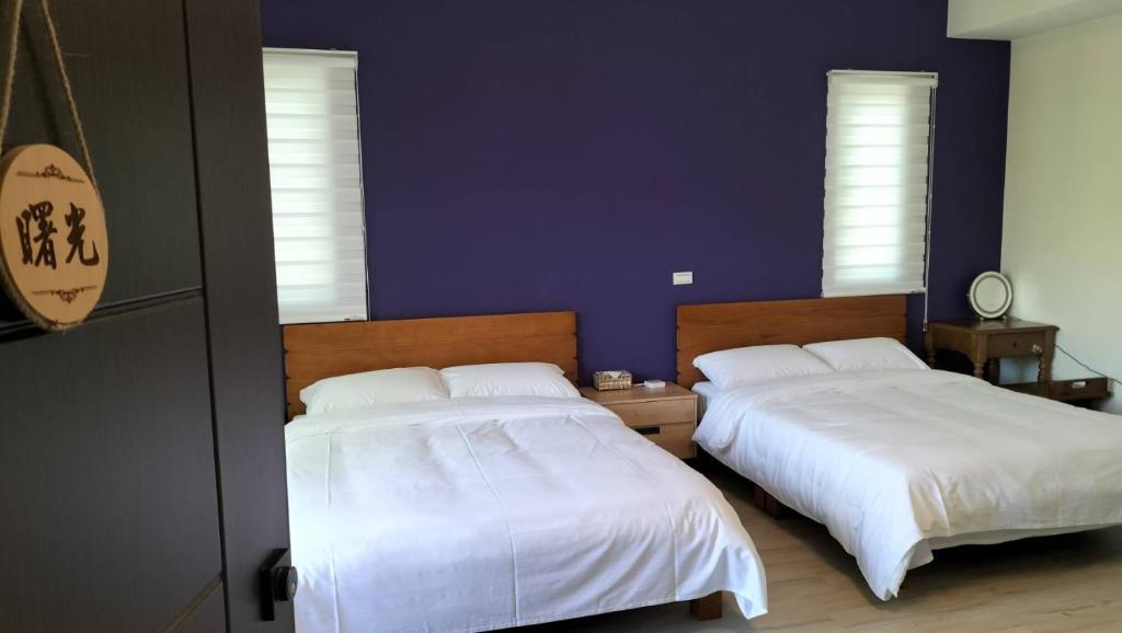 Postel nebo postele na pokoji v ubytování Liangchen B&B