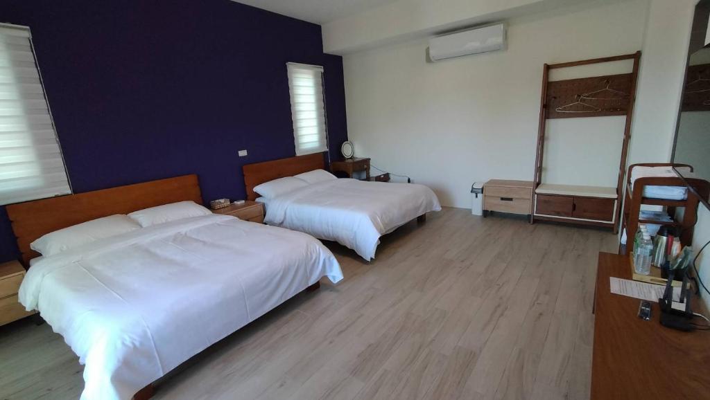 Postel nebo postele na pokoji v ubytování Liangchen B&B