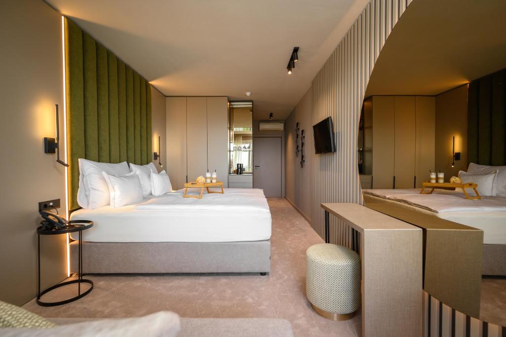 Postel nebo postele na pokoji v ubytování Hotel Malin