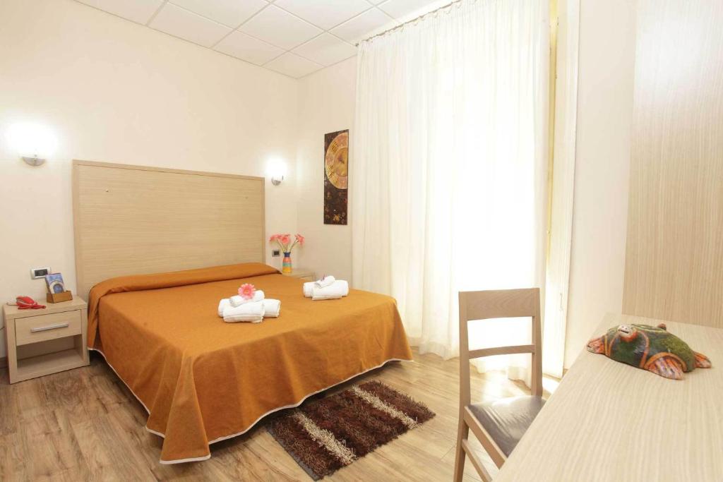 Postel nebo postele na pokoji v ubytování Albergo Maccotta