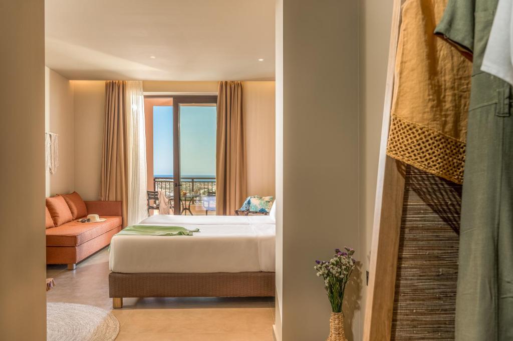 Postel nebo postele na pokoji v ubytování Hotel Pyriá