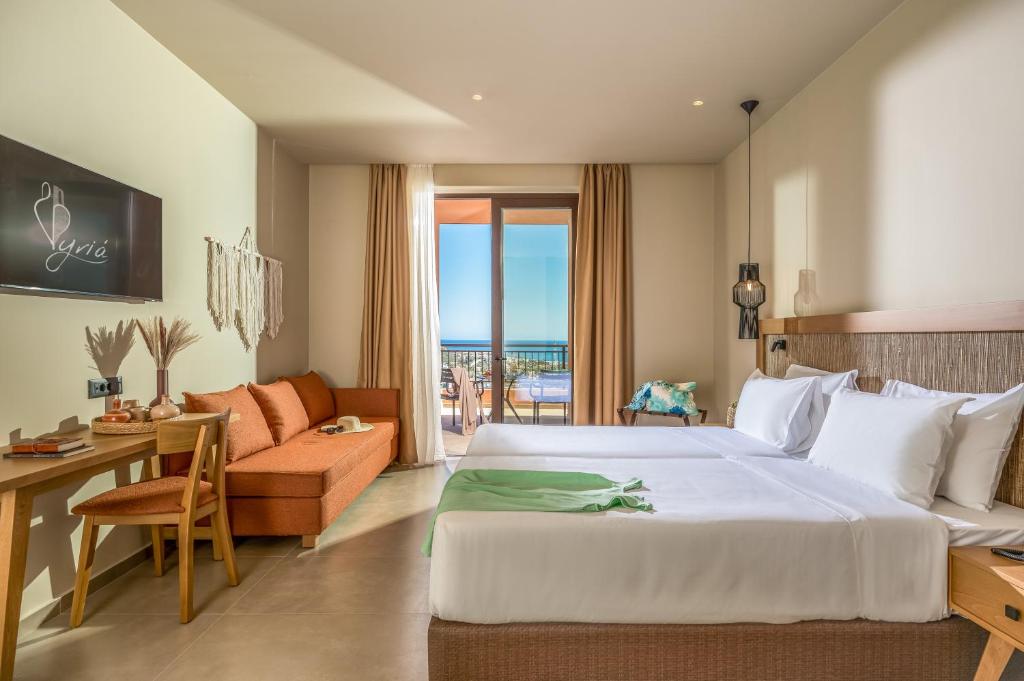 Postel nebo postele na pokoji v ubytování Hotel Pyriá