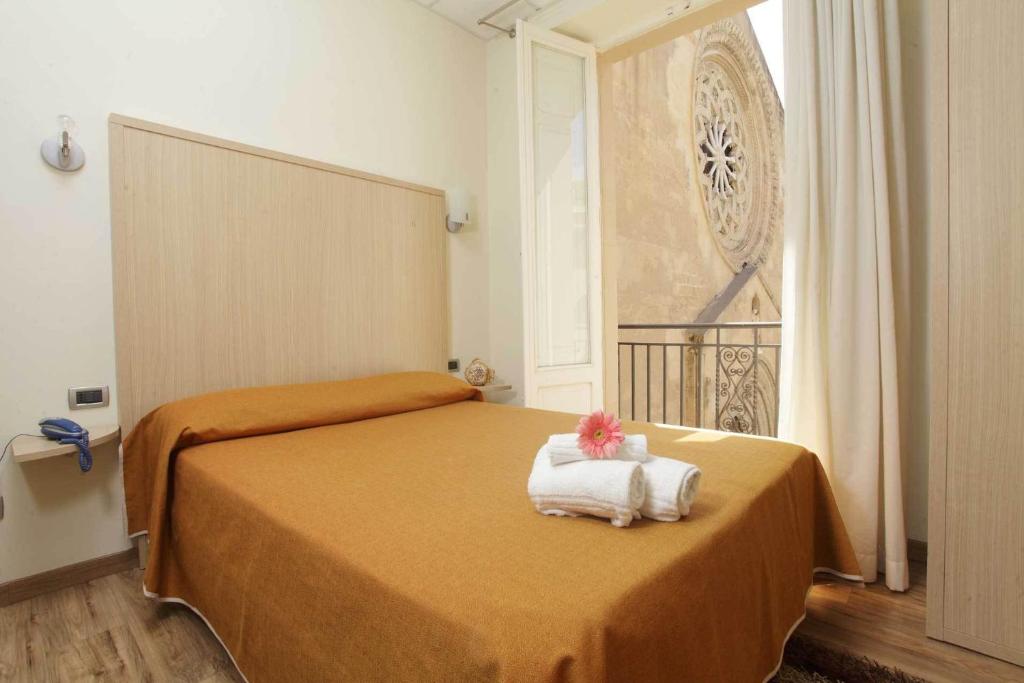 Postel nebo postele na pokoji v ubytování Albergo Maccotta
