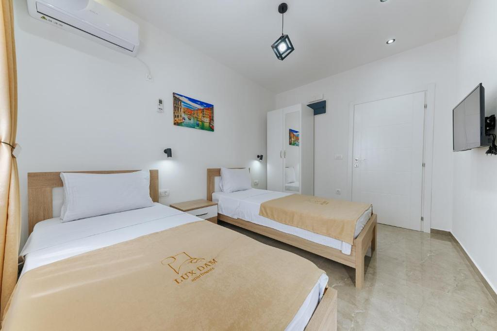 Postel nebo postele na pokoji v ubytování Lux DAM Apartments