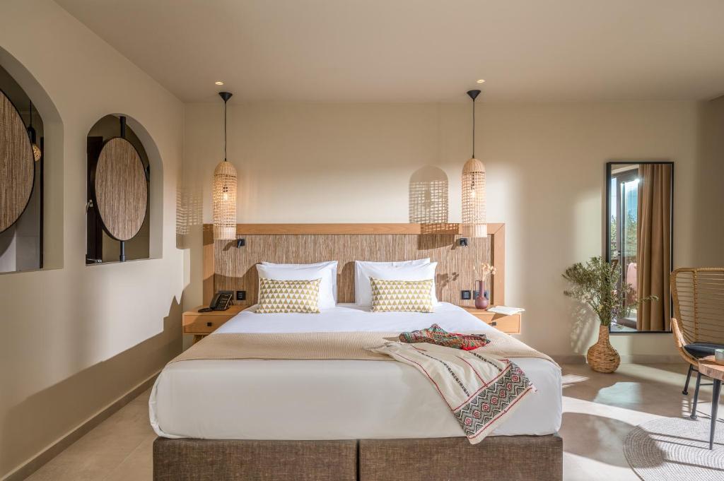 Postel nebo postele na pokoji v ubytování Hotel Pyriá