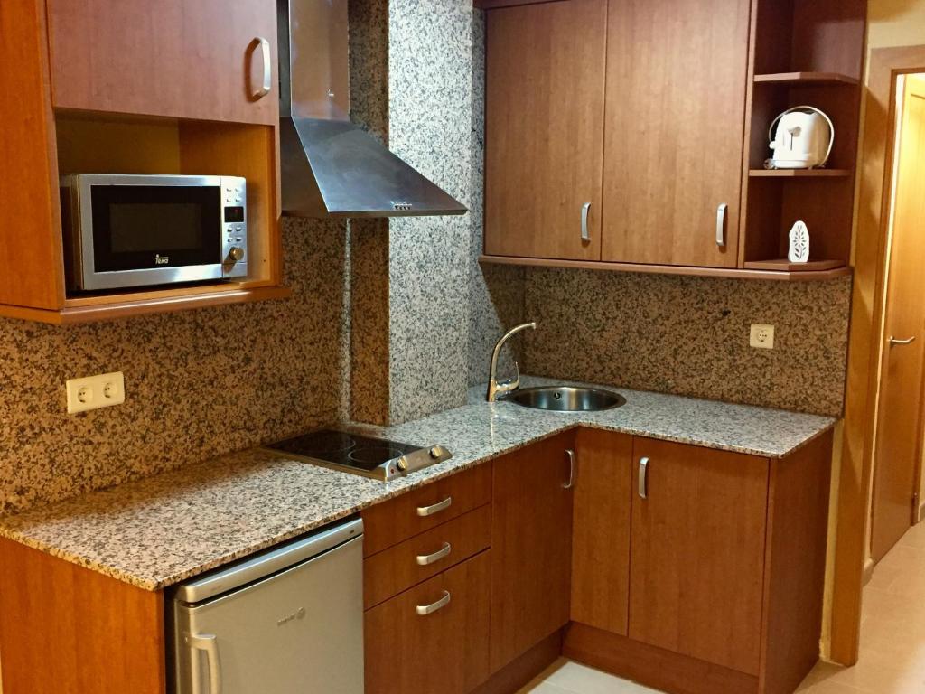 Kuchyň nebo kuchyňský kout v ubytování Apartament Escaladei